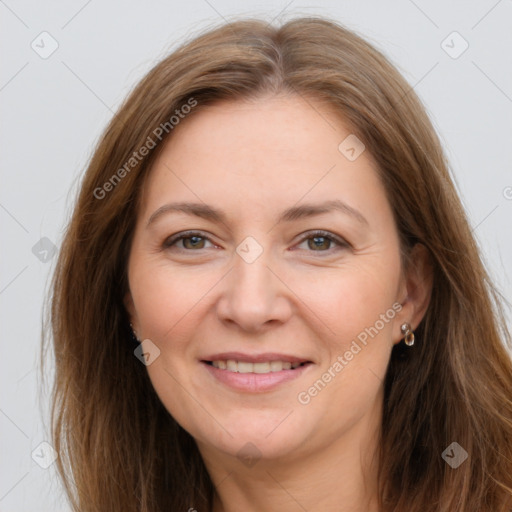 Joyful white adult female with long  brown hair and brown eyes