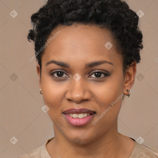 Joyful black young-adult female with short  black hair and brown eyes