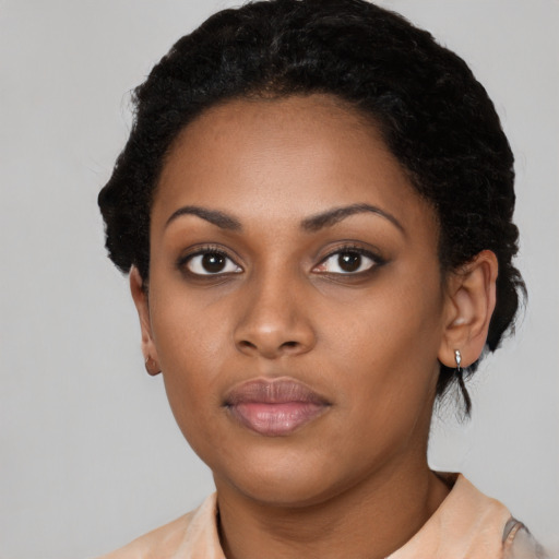 Neutral black young-adult female with short  black hair and brown eyes