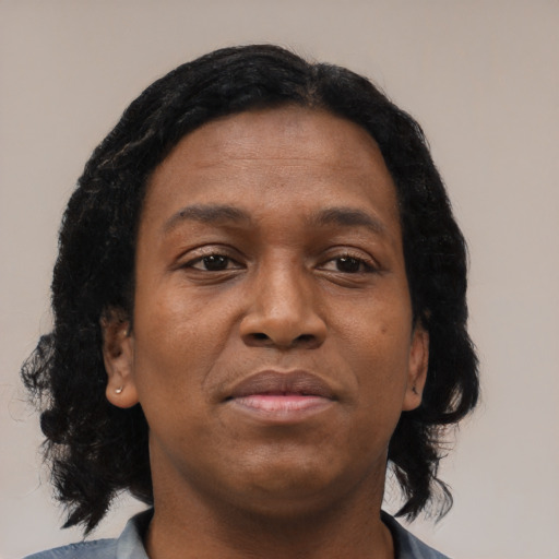Neutral black young-adult female with medium  brown hair and brown eyes