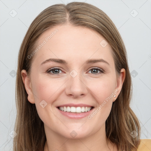 Joyful white young-adult female with long  brown hair and grey eyes