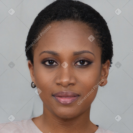 Joyful black young-adult female with short  black hair and brown eyes