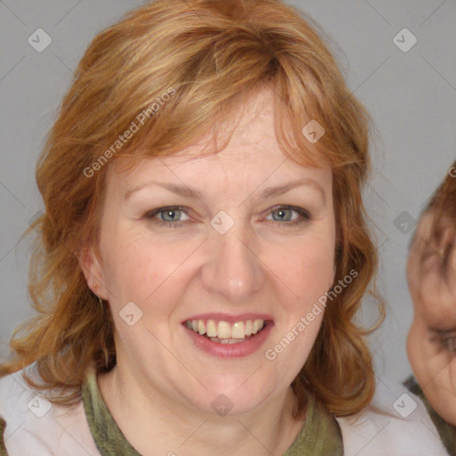 Joyful white adult female with medium  brown hair and blue eyes