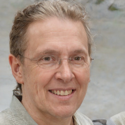 Joyful white middle-aged male with short  brown hair and brown eyes