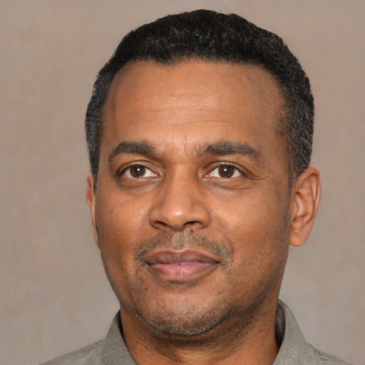 Neutral latino adult male with short  black hair and brown eyes