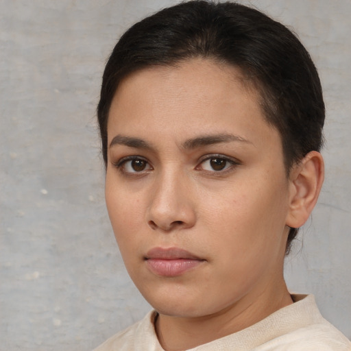 Neutral white young-adult female with short  brown hair and brown eyes