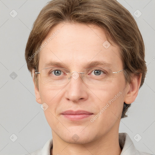 Joyful white adult female with short  brown hair and grey eyes