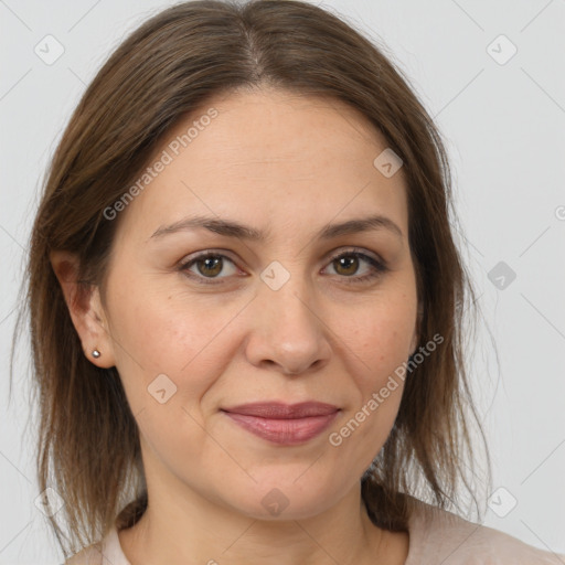 Joyful white adult female with medium  brown hair and brown eyes