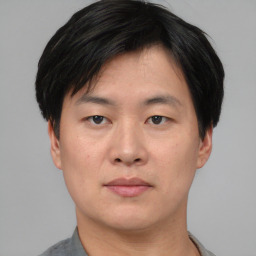 Neutral asian young-adult male with short  black hair and brown eyes