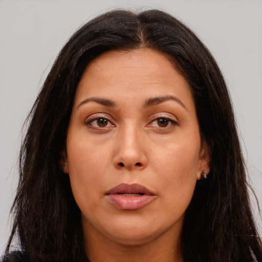 Joyful asian adult female with long  brown hair and brown eyes