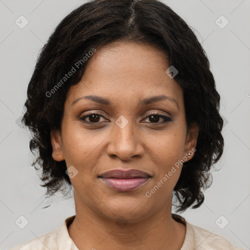 Joyful black young-adult female with medium  brown hair and brown eyes