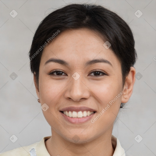 Joyful asian young-adult female with short  brown hair and brown eyes