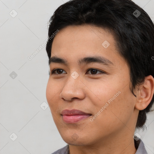 Joyful white young-adult male with short  black hair and brown eyes