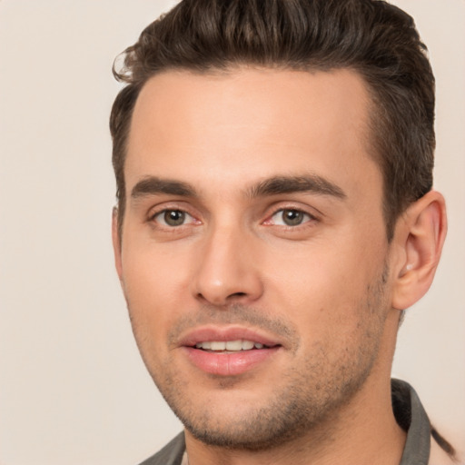 Joyful white young-adult male with short  brown hair and brown eyes