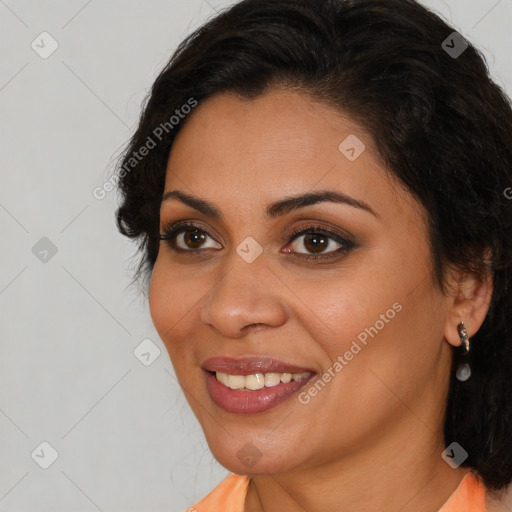 Joyful latino young-adult female with long  brown hair and brown eyes