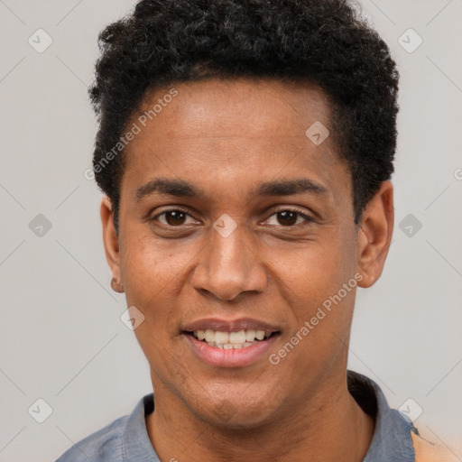 Joyful black young-adult male with short  black hair and brown eyes