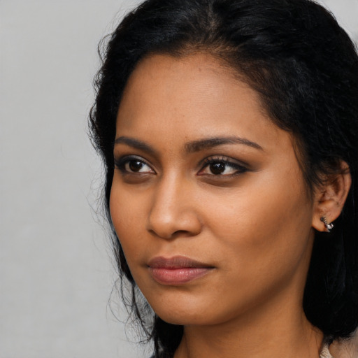 Neutral latino young-adult female with medium  black hair and brown eyes