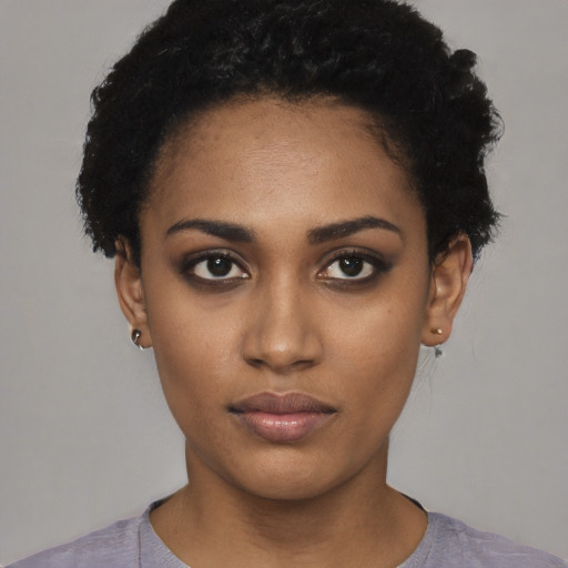 Neutral black young-adult female with short  black hair and brown eyes