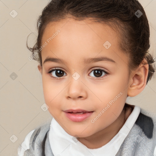 Joyful white child female with short  brown hair and brown eyes