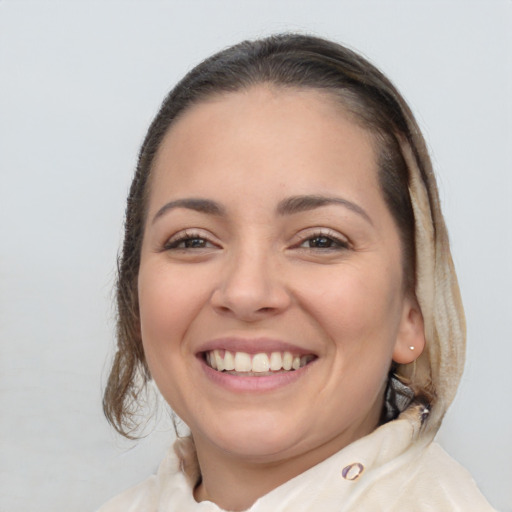 Joyful white young-adult female with medium  brown hair and brown eyes