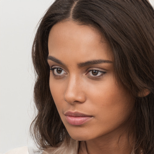 Neutral white young-adult female with long  brown hair and brown eyes