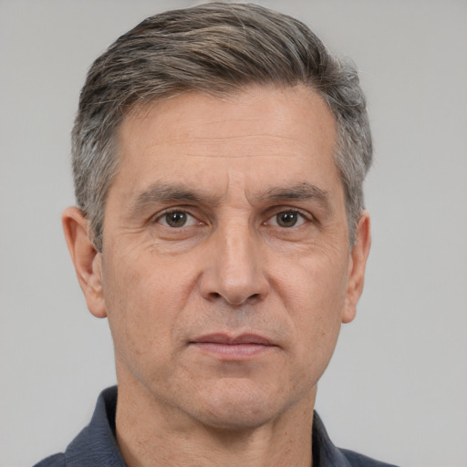 Neutral white middle-aged male with short  black hair and brown eyes