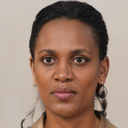 Neutral black adult female with short  black hair and brown eyes