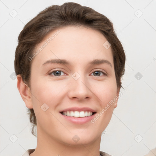 Joyful white young-adult female with short  brown hair and grey eyes