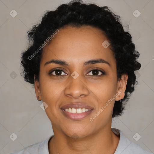 Joyful black young-adult female with short  black hair and brown eyes