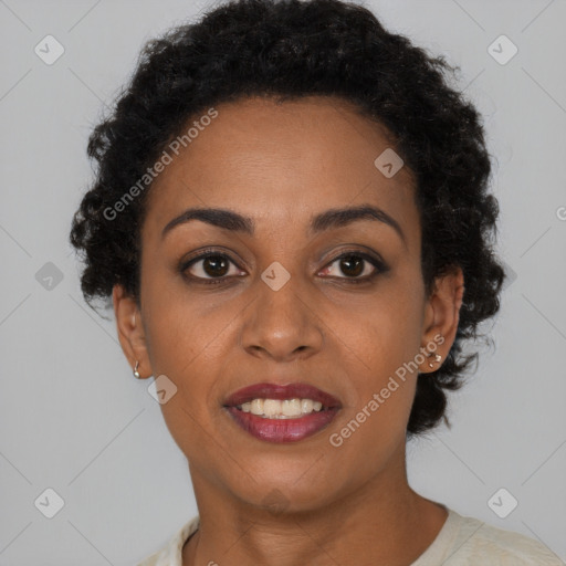 Joyful black young-adult female with short  brown hair and brown eyes