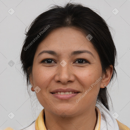 Joyful asian adult female with medium  brown hair and brown eyes