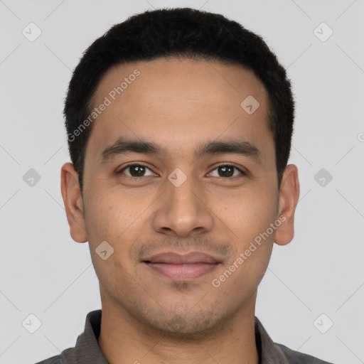 Joyful latino young-adult male with short  black hair and brown eyes