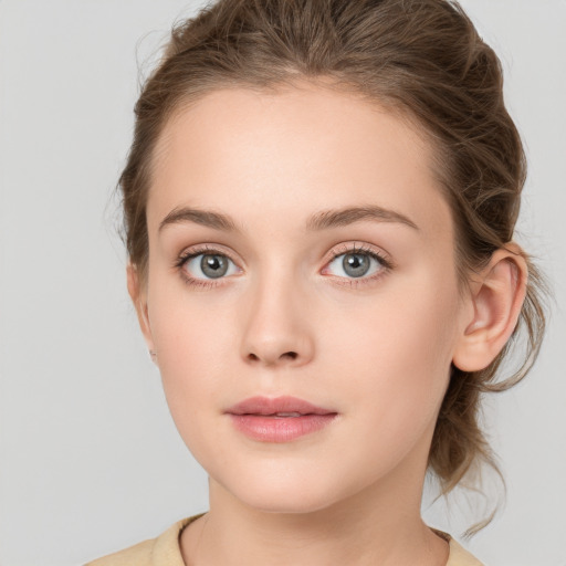 Neutral white young-adult female with medium  brown hair and grey eyes