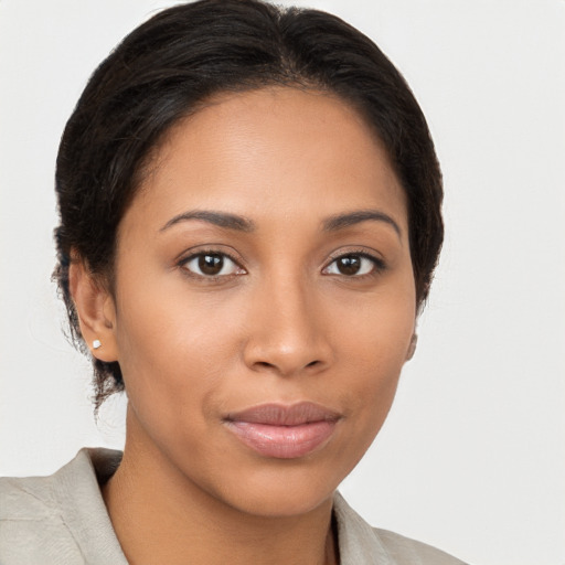 Joyful latino young-adult female with medium  brown hair and brown eyes