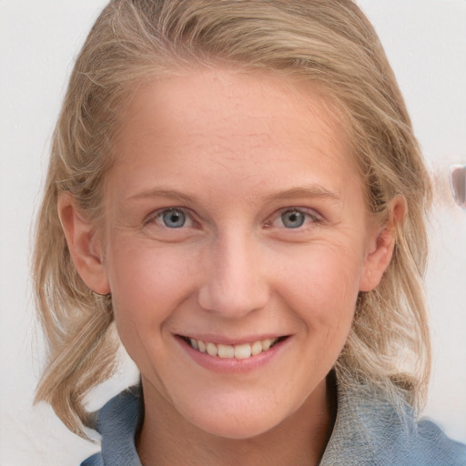 Joyful white young-adult female with medium  blond hair and blue eyes