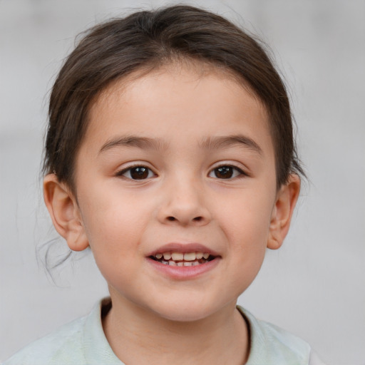 Joyful white child female with medium  brown hair and brown eyes