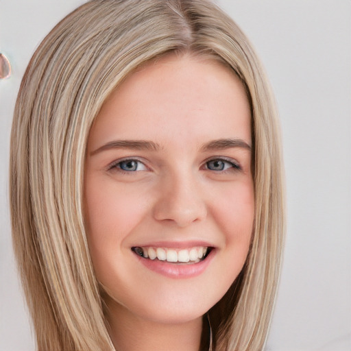 Joyful white young-adult female with long  brown hair and blue eyes