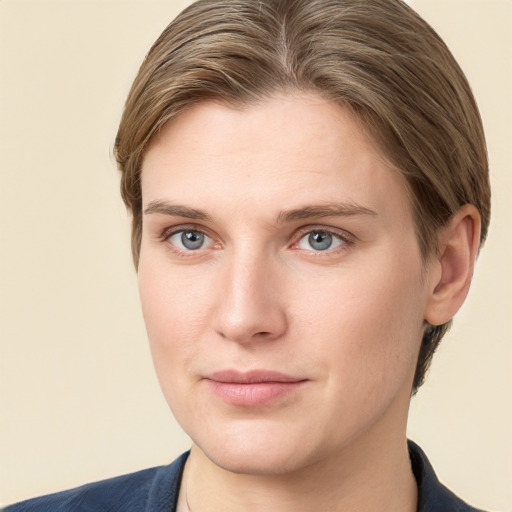 Joyful white young-adult female with short  brown hair and grey eyes