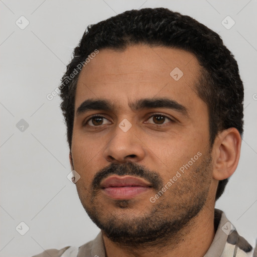 Neutral latino young-adult male with short  black hair and brown eyes