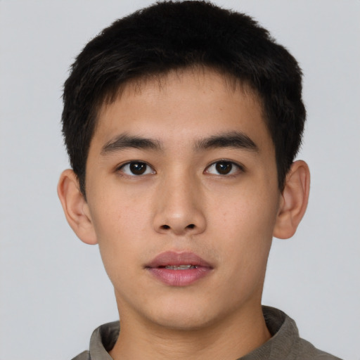 Neutral asian young-adult male with short  brown hair and brown eyes