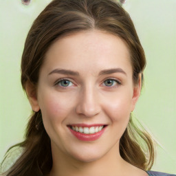 Joyful white young-adult female with long  brown hair and green eyes