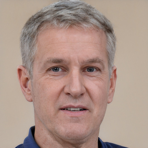 Neutral white middle-aged male with short  gray hair and brown eyes