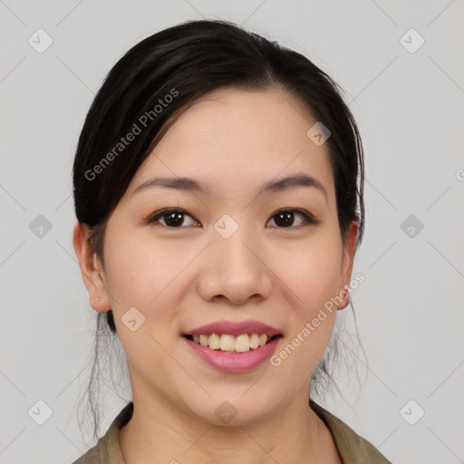 Joyful asian young-adult female with medium  black hair and brown eyes