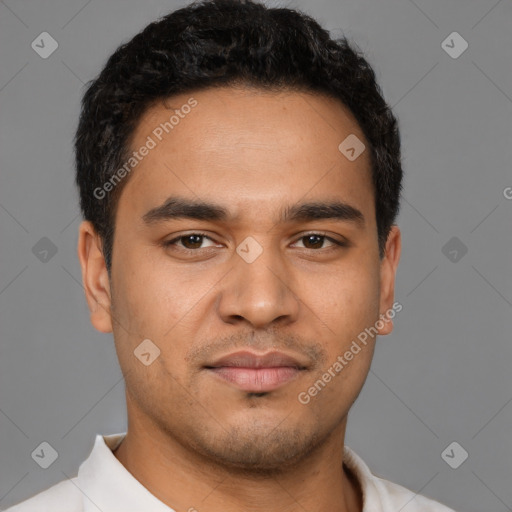 Neutral latino young-adult male with short  brown hair and brown eyes