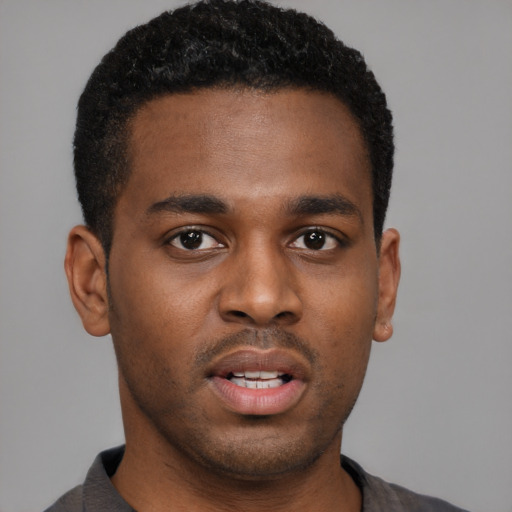 Neutral black young-adult male with short  brown hair and brown eyes
