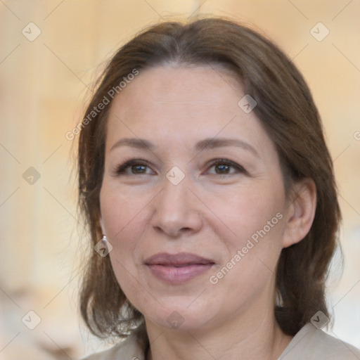 Joyful white adult female with medium  brown hair and brown eyes