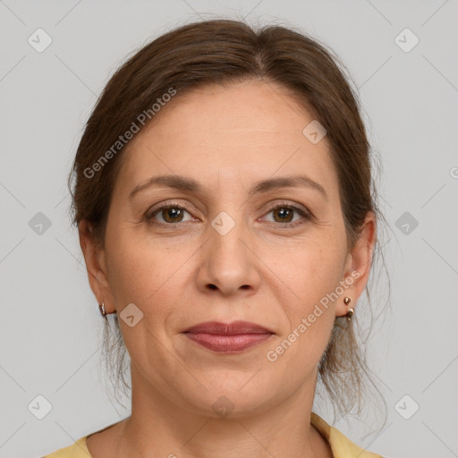 Joyful white adult female with medium  brown hair and grey eyes