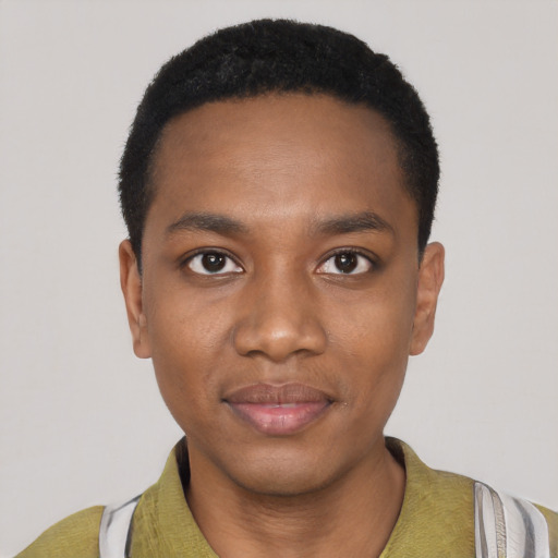Joyful black young-adult male with short  black hair and brown eyes