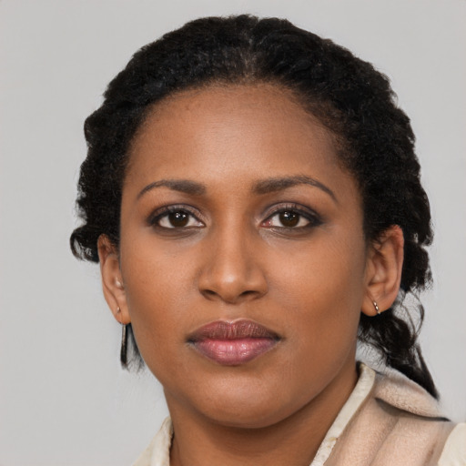 Neutral black young-adult female with short  brown hair and brown eyes