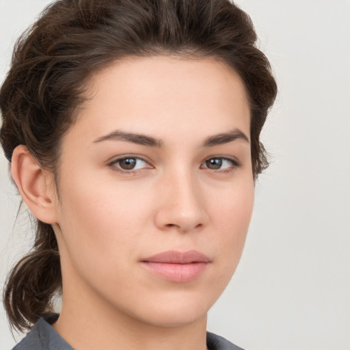 Neutral white young-adult female with short  brown hair and brown eyes